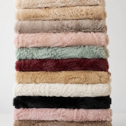 Stack of soft German mohair fabric in assorted colors